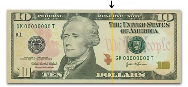 Ten Dollar Bill under blacklight