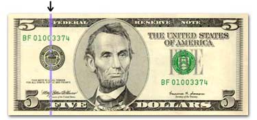 Five Dollar Bill under blacklight